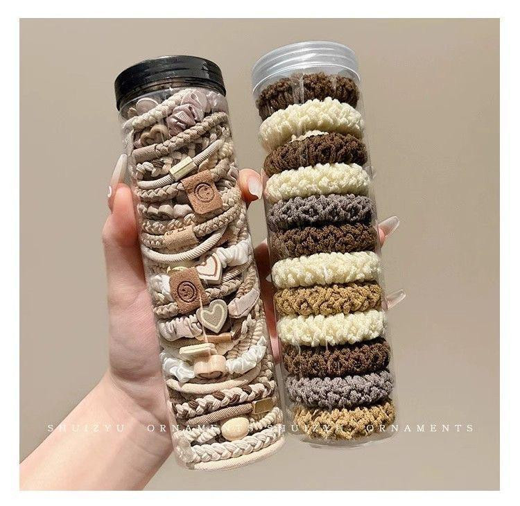 علبة أربطة شعر مرنة (20 حبة) بألوان طبيعية (أسود وبني) غير مؤذية للشعر ومقاومة للانزلاق ?