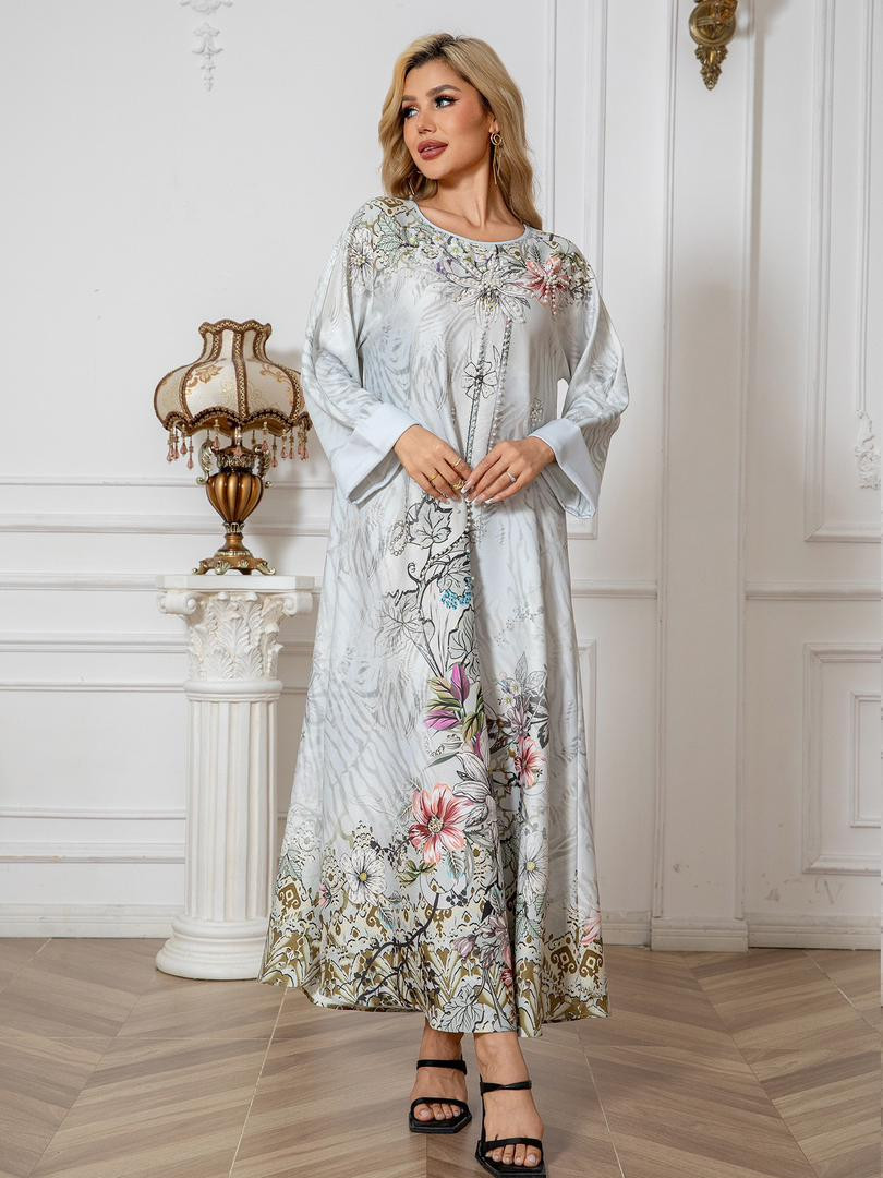 جلابية نسائية فخمة طويلة بنقشة زهور أنيقة مرصّعة باللؤلؤ والخرز بأسلوب أوروبي راقٍ تناسب المناسبات الخاصة ?? المقاسات: من S إلى XXL الخامة: خامة ساتان ناعمة مطبوعة بجودة عالية مع تطريز لؤلؤي ولمسات أن