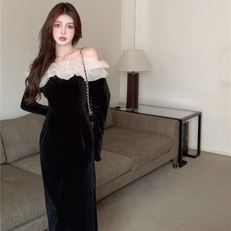 فستان أسود فاخر من المخمل الفرنسي بتصميم كلاسيكي راقٍ بخامة حريرية لامعة وتفاصيل أنيقة مثالية للخريف